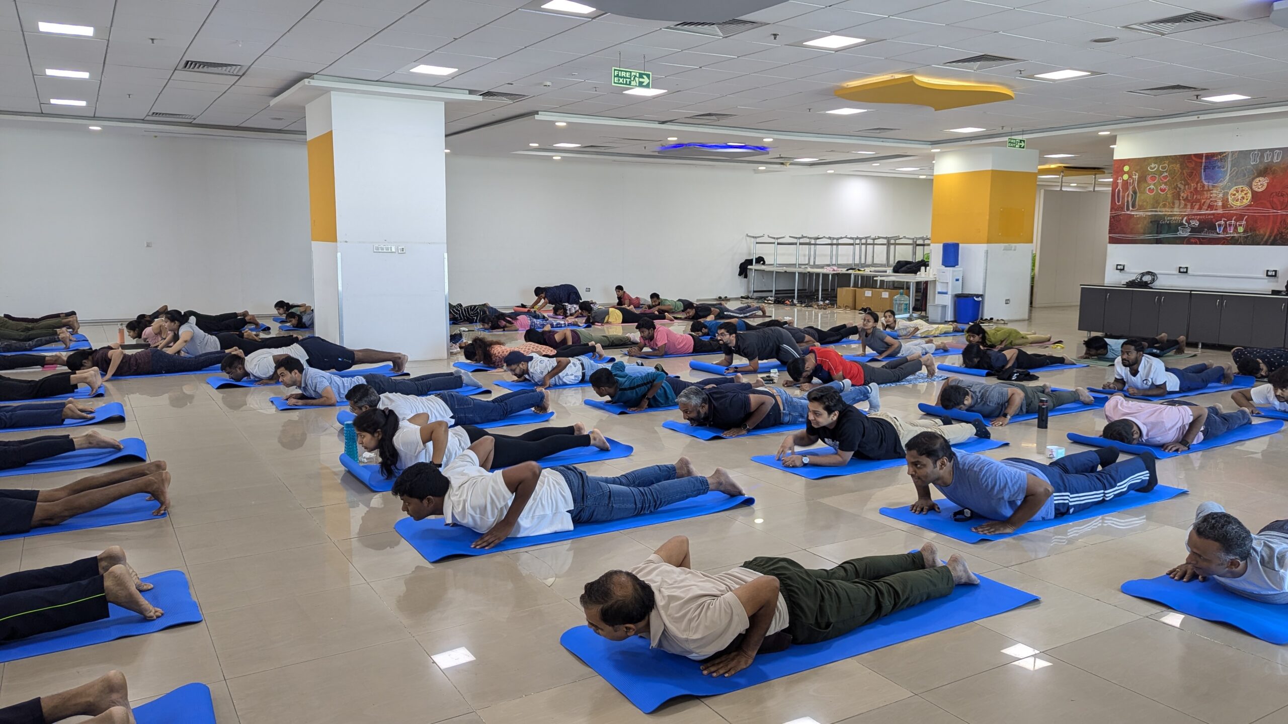 Large-scale corporate yoga session — Chittamandara wellness workshops
