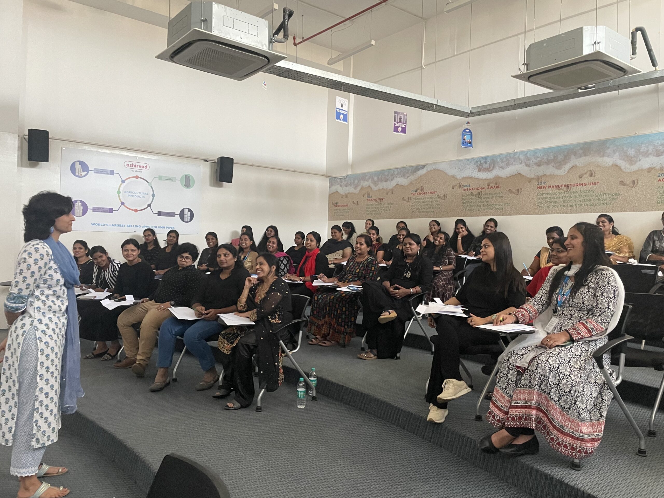 Shruthi leading a corporate workshop — burnout article